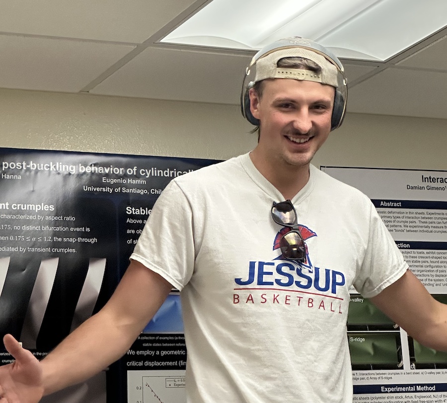 photograph of Chris Redman near the lab ceiling