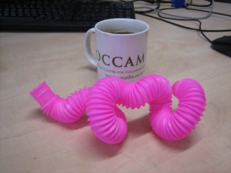 pink pop toob bendy straw in front of OCCAM mug